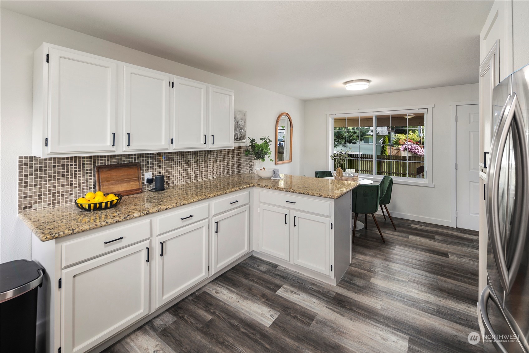 19404 4th Drive Southeast Bothell, WA 98012 - Photo 12 of 33 a kitchen with a sink window and cabinets