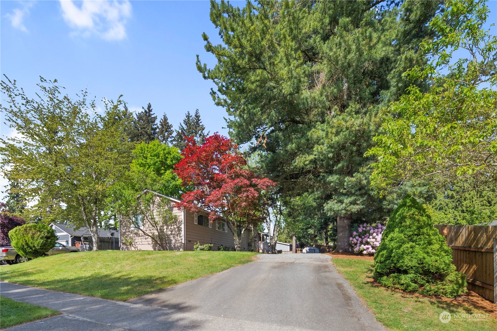 19404 4th Drive Southeast Bothell, WA 98012 - Photo 29 of 33 a front view of a house with a yard and fountain in middle