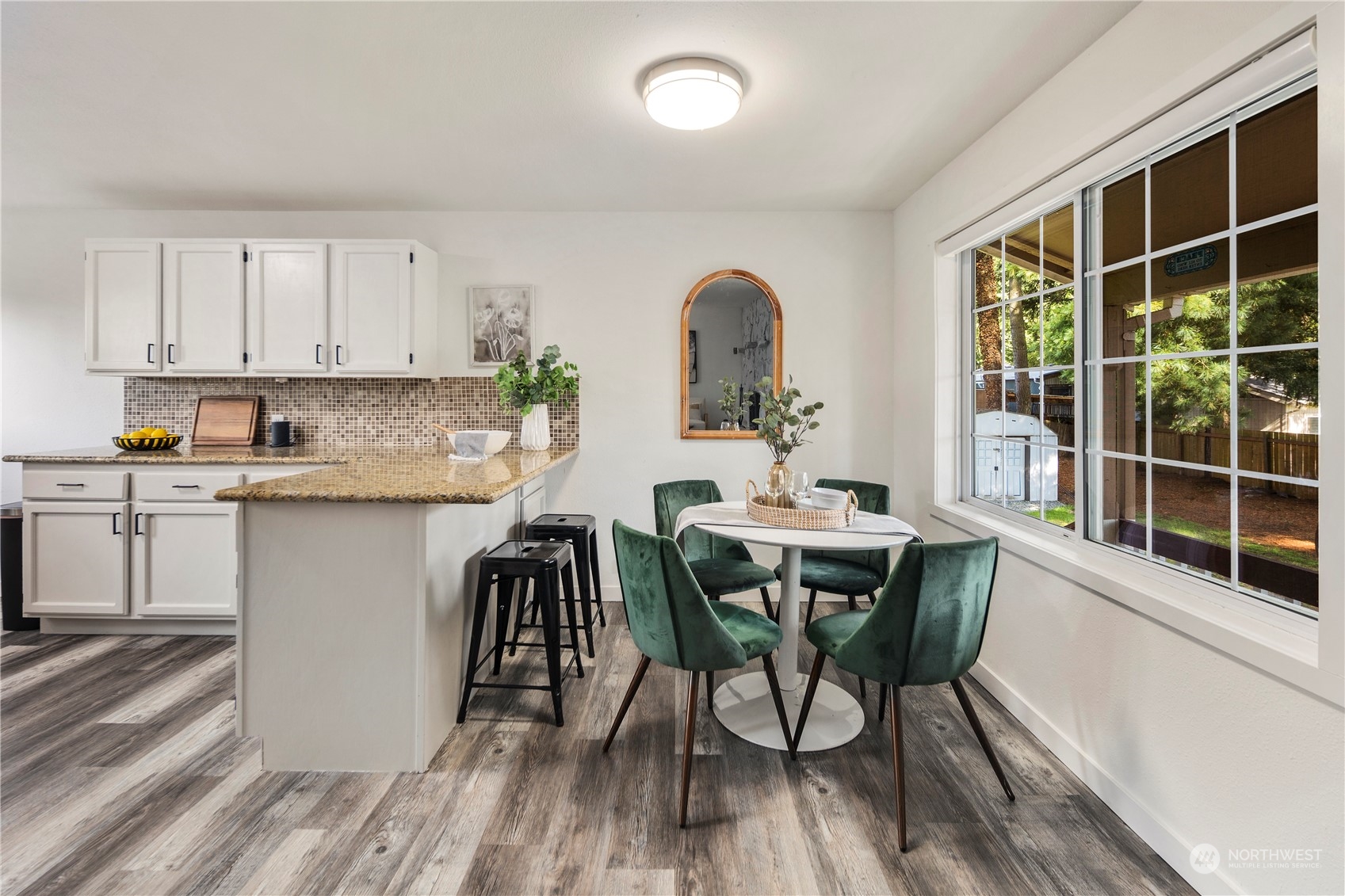 19404 4th Drive Southeast Bothell, WA 98012 - Photo 7 of 33 a view of a dining room with furniture window and wooden floor