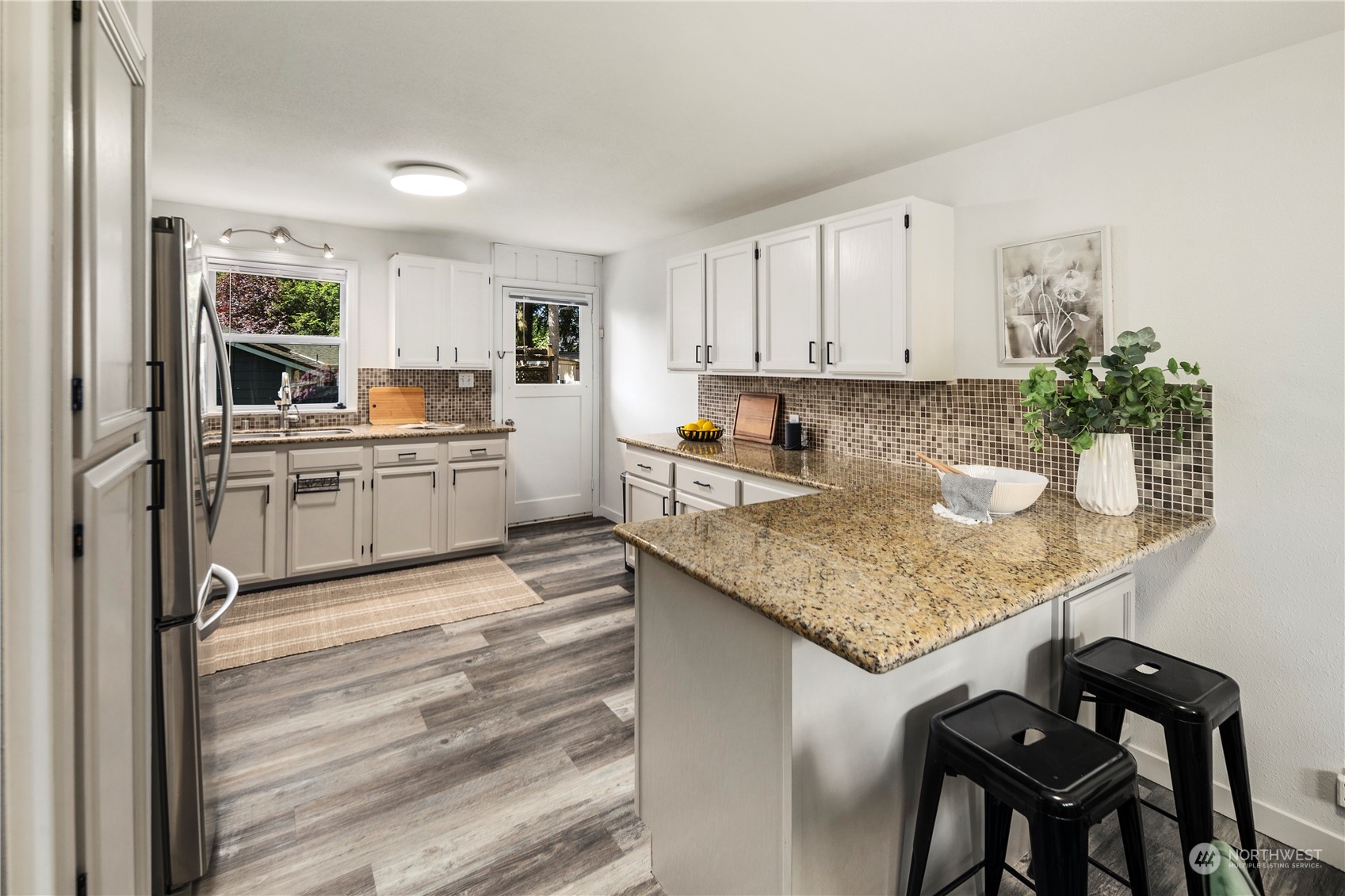 19404 4th Drive Southeast Bothell, WA 98012 - Photo 9 of 33 a kitchen with stainless steel appliances granite countertop a sink stove and cabinets