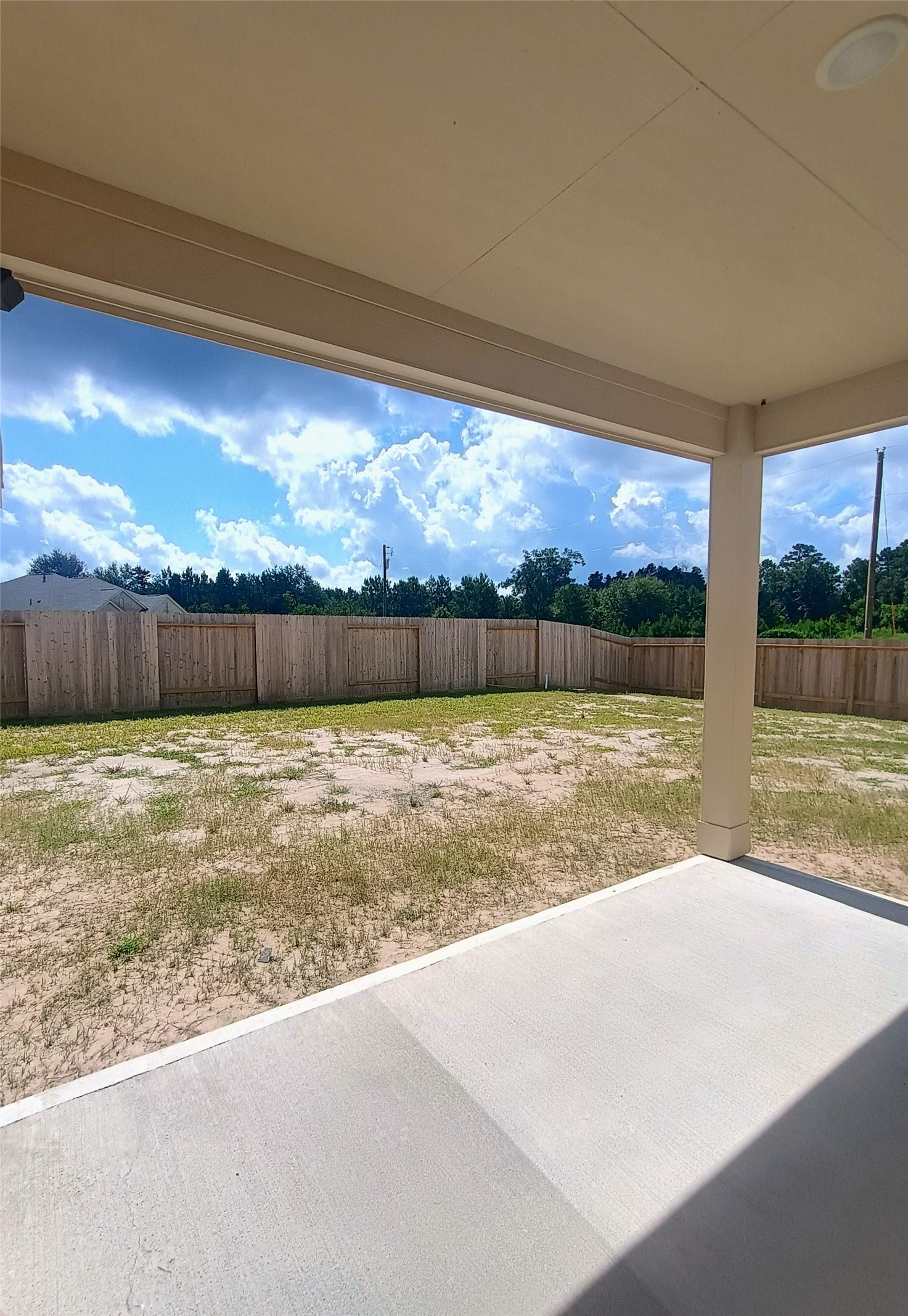 26414 Cooperstown Way Splendora, TX 77372 - Photo 20 of 23 a view of swimming pool with outdoor seating and yard in back
