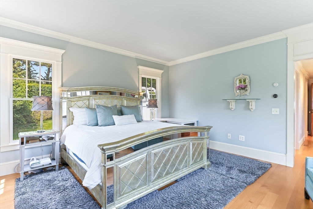 785 Old Harbor Road Chatham, MA 02650 - Photo 13 of 40 a bed sitting in a bedroom next to a window