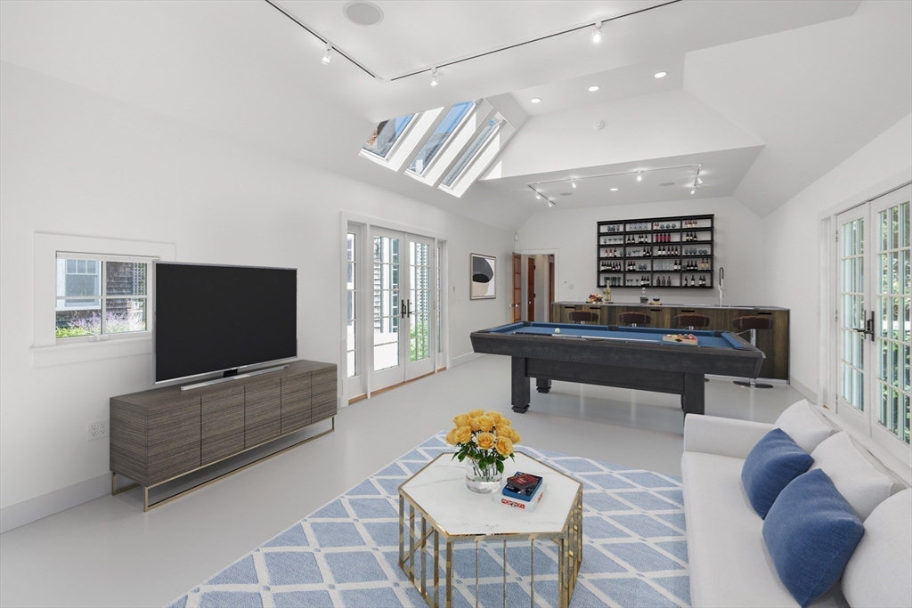 785 Old Harbor Road Chatham, MA 02650 - Photo 16 of 40 a living room with furniture and a flat screen tv