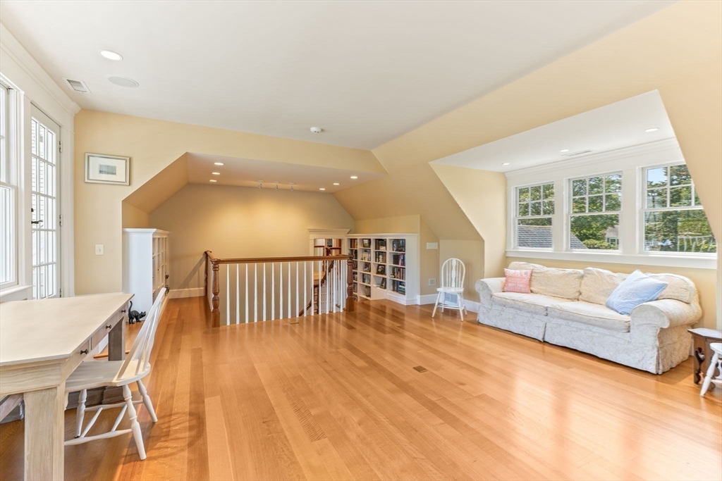 785 Old Harbor Road Chatham, MA 02650 - Photo 19 of 40 a spacious bedroom with a bed and a couch