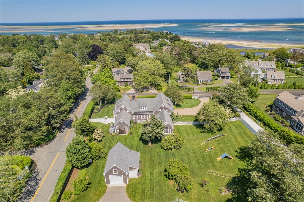 785 Old Harbor Road Chatham, MA 02650 - Photo 3 of 40 a view of lot of trees and houses