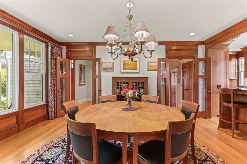 785 Old Harbor Road Chatham, MA 02650 - Photo 6 of 40 a view of a dining room with furniture window and wooden floor