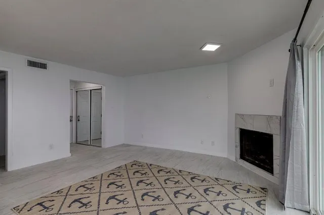 a an empty room with a fireplace