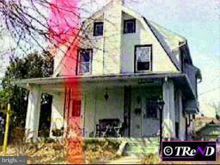 330 Oxford Road Havertown, PA 19083 - Photo 1 of 1 a view of a white house with large windows and a small yard