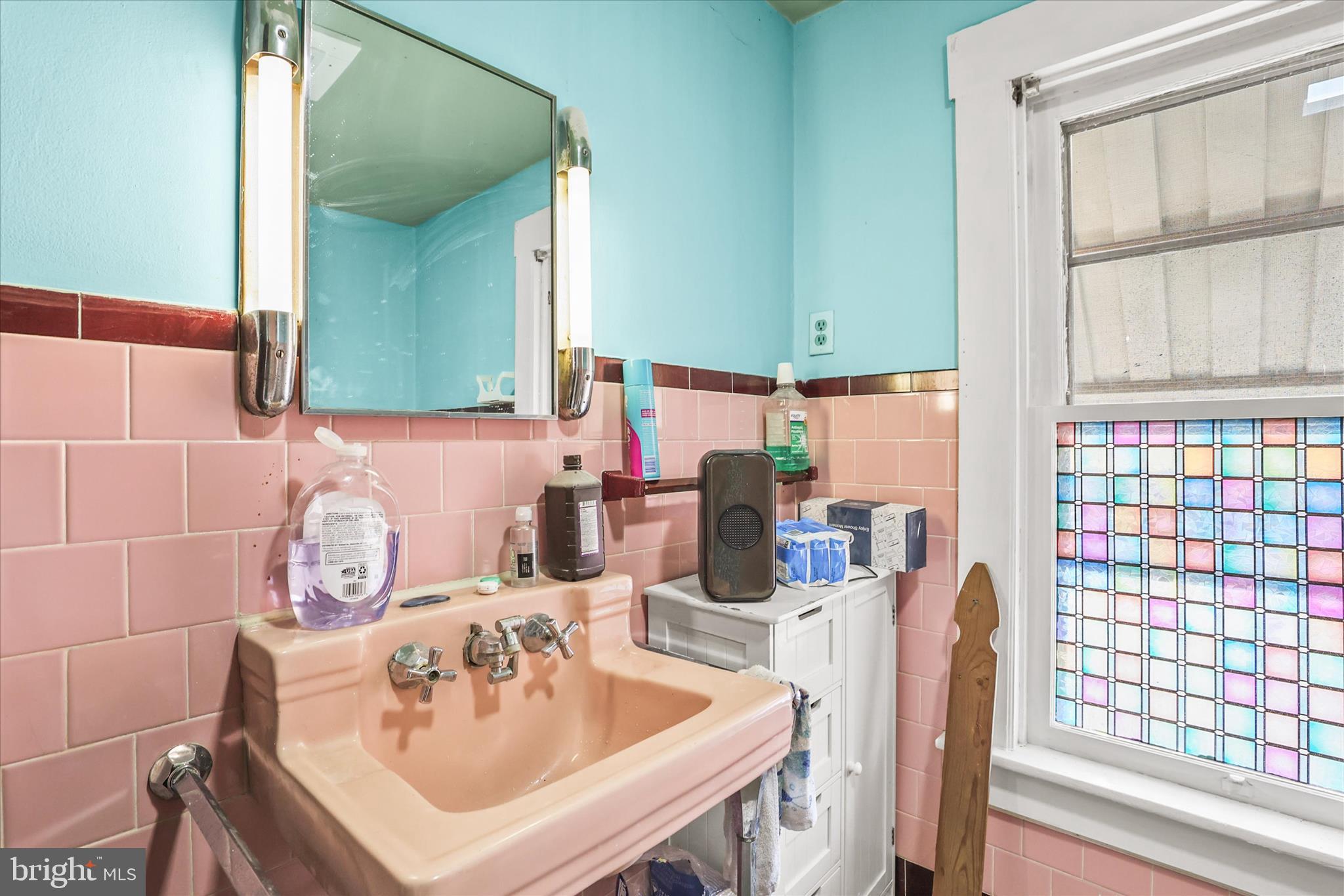 4 Penn Street Hanover, PA 17331 - Photo 16 of 28 a bathroom with a sink and a mirror