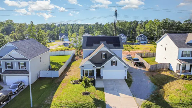 an aerial view of a house with a swimming pool