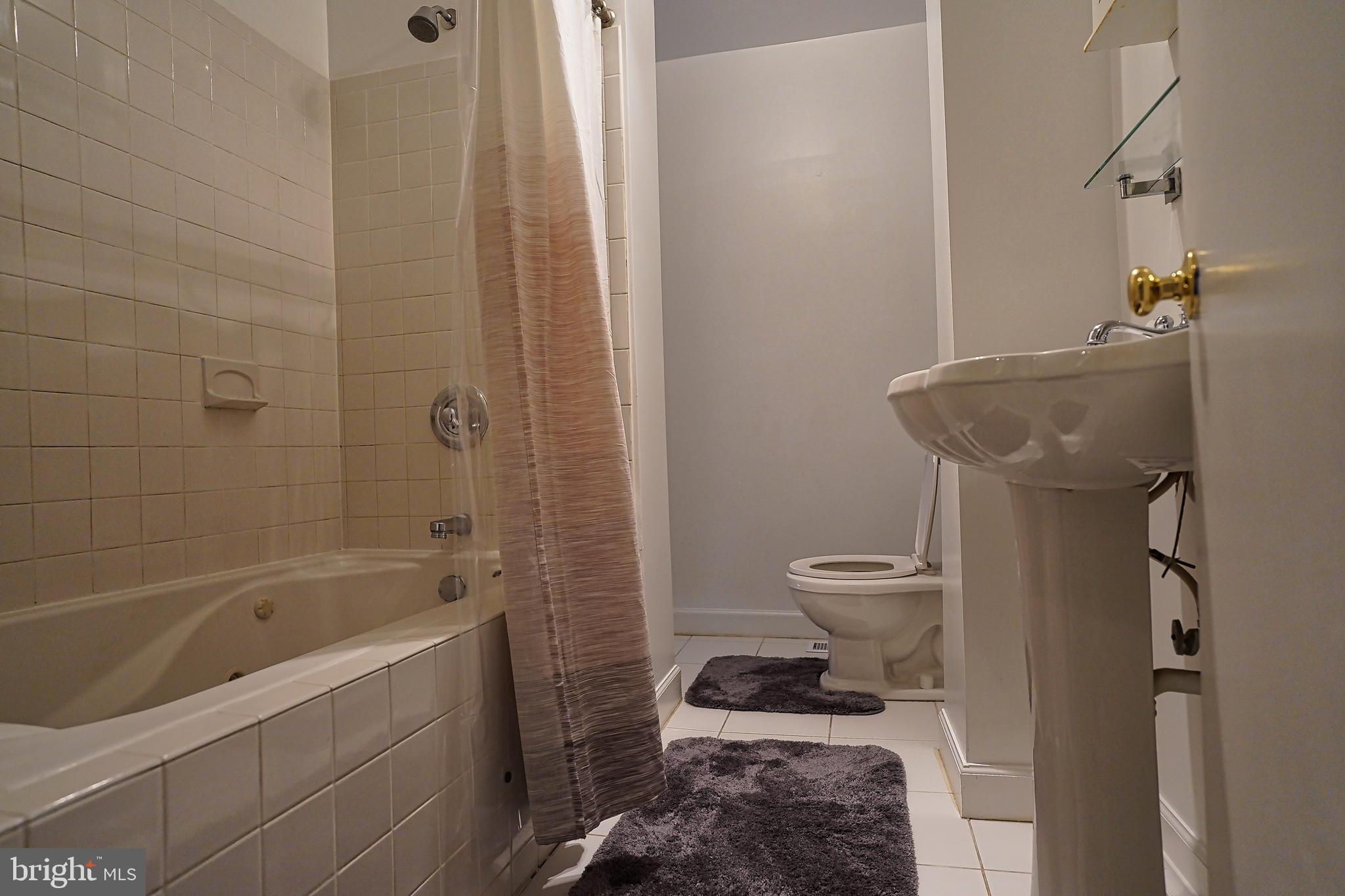 6948 Rockfield Road Baltimore, MD 21244 - Photo 31 of 47 a bathroom with a toilet and a shower