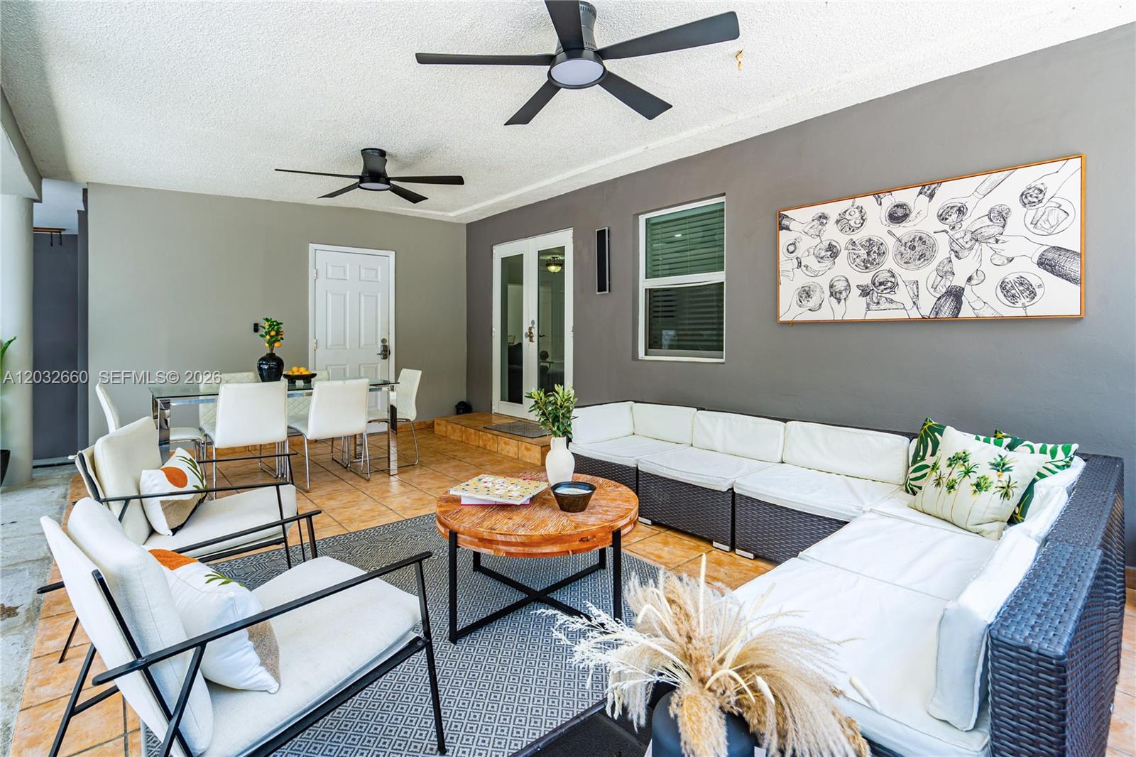 520 Southwest 22nd Road Miami, FL 33129 - Photo 22 of 76 a living room with furniture a ceiling fan and a window