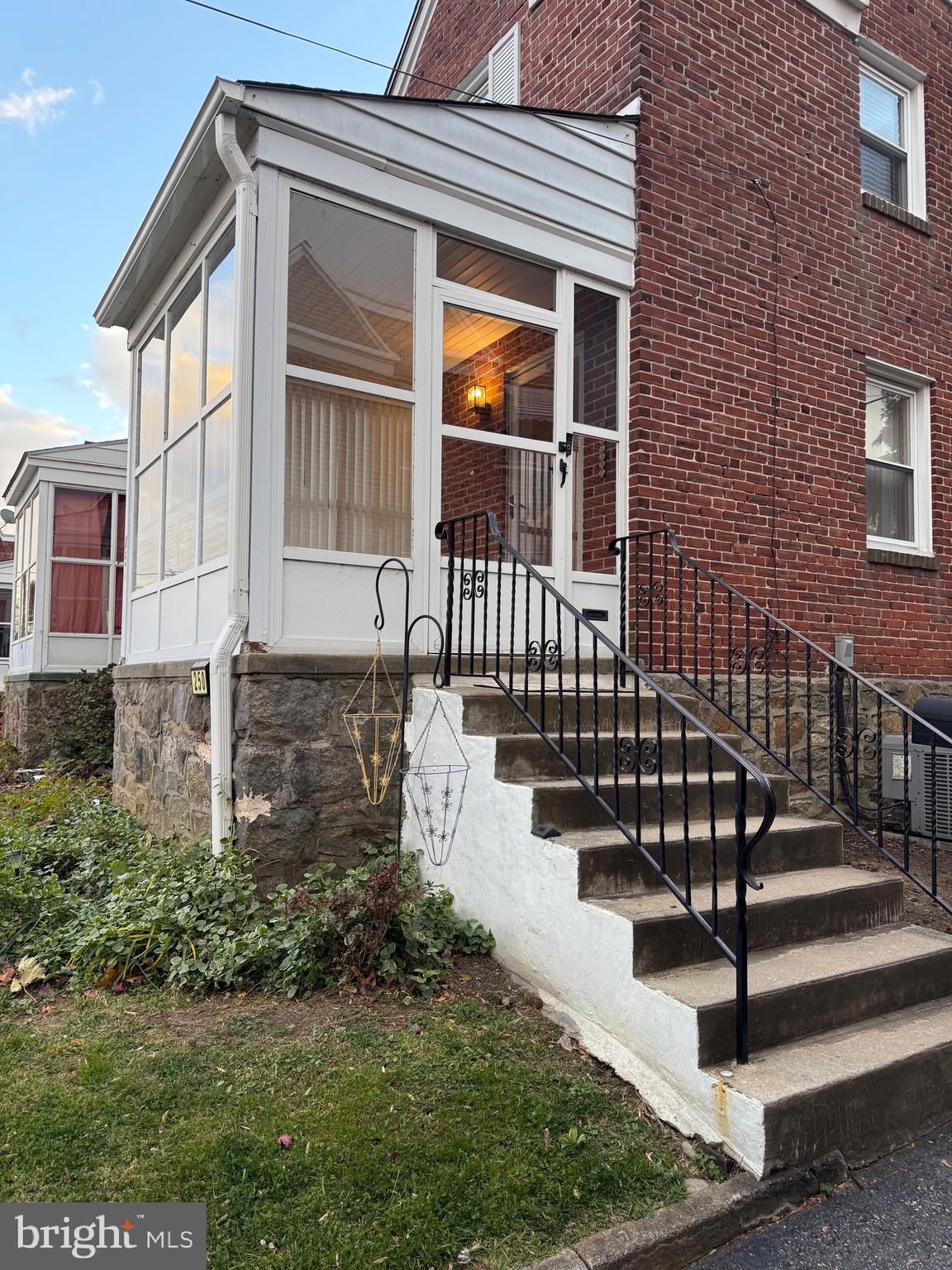 250 East Avon Road Brookhaven, PA 19015 - Photo 2 of 61 a view of a house with wooden fence and a porch
