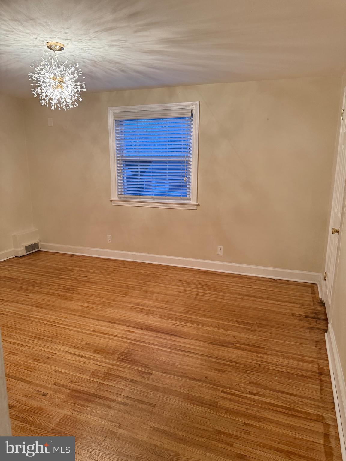 250 East Avon Road Brookhaven, PA 19015 - Photo 30 of 61 a view of an empty room with wooden floor