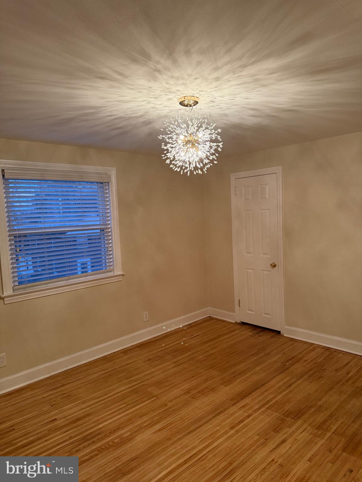 250 East Avon Road Brookhaven, PA 19015 - Photo 31 of 61 a view of a room with wooden floor and chandelier