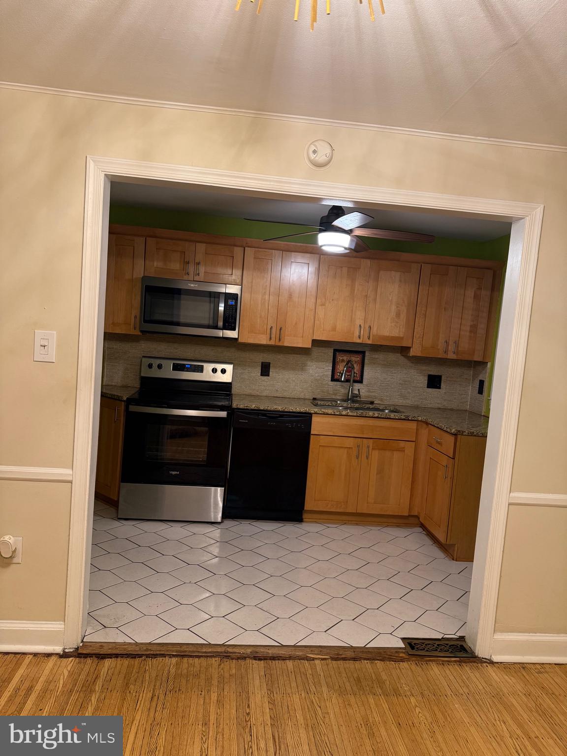 250 East Avon Road Brookhaven, PA 19015 - Photo 38 of 61 a kitchen with granite countertop a stove and cabinets