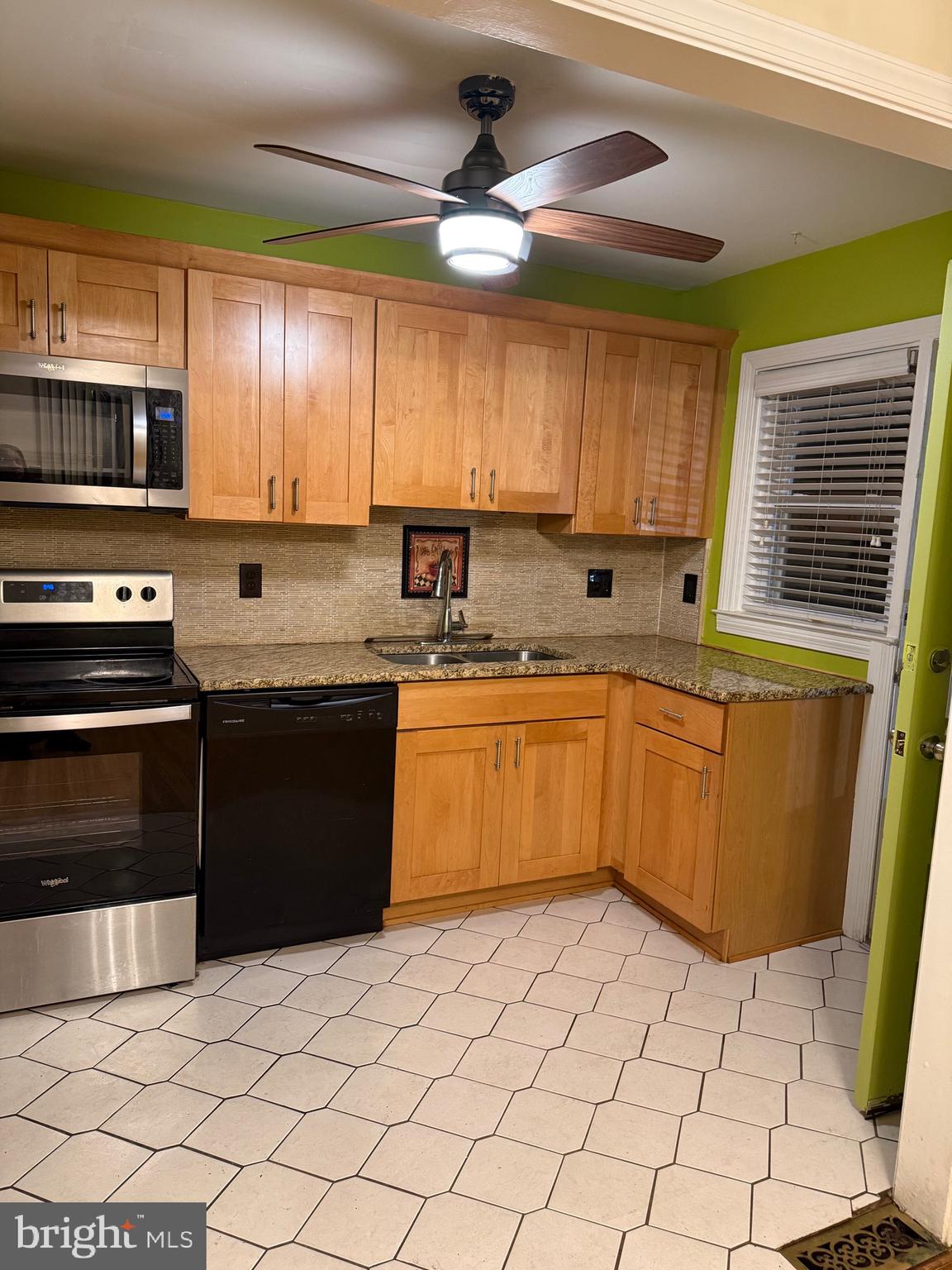 250 East Avon Road Brookhaven, PA 19015 - Photo 40 of 61 a kitchen with a sink a stove top oven and cabinets