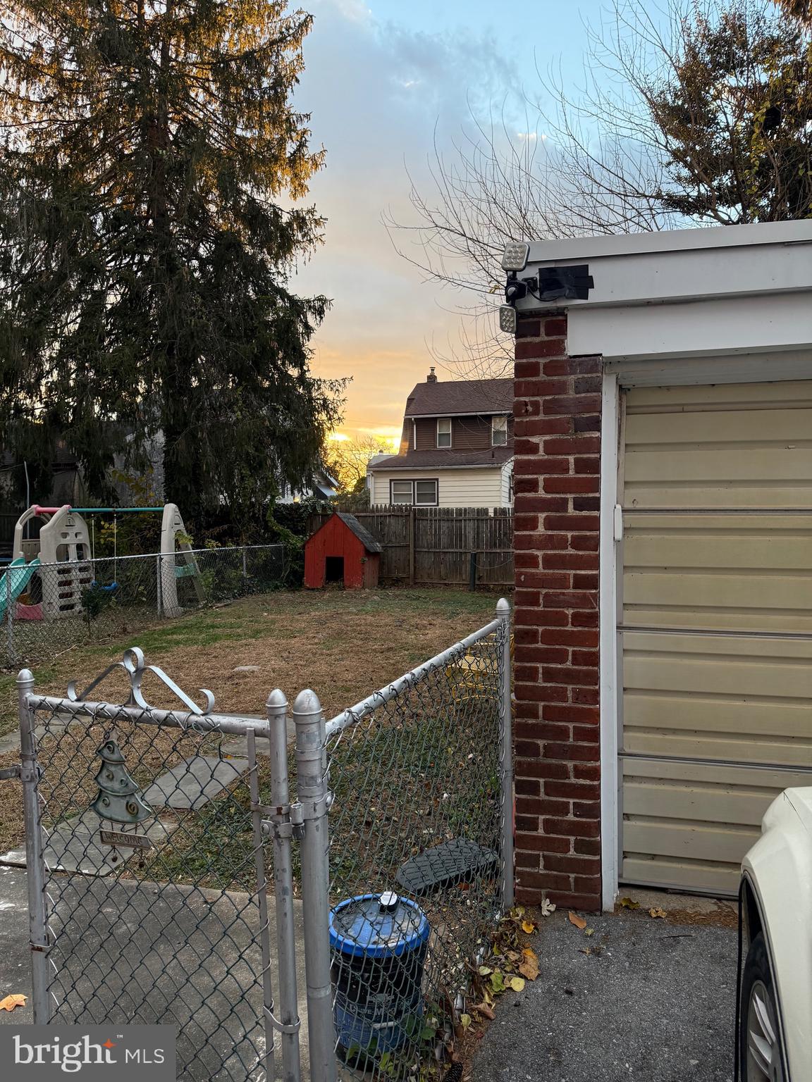 250 East Avon Road Brookhaven, PA 19015 - Photo 59 of 61 a view of a patio with table and chairs and a fire pit