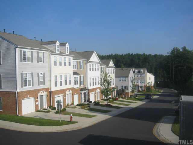 Townhouse sits atop hill, overlooking the development. Other