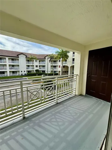 a view of a balcony with stairs