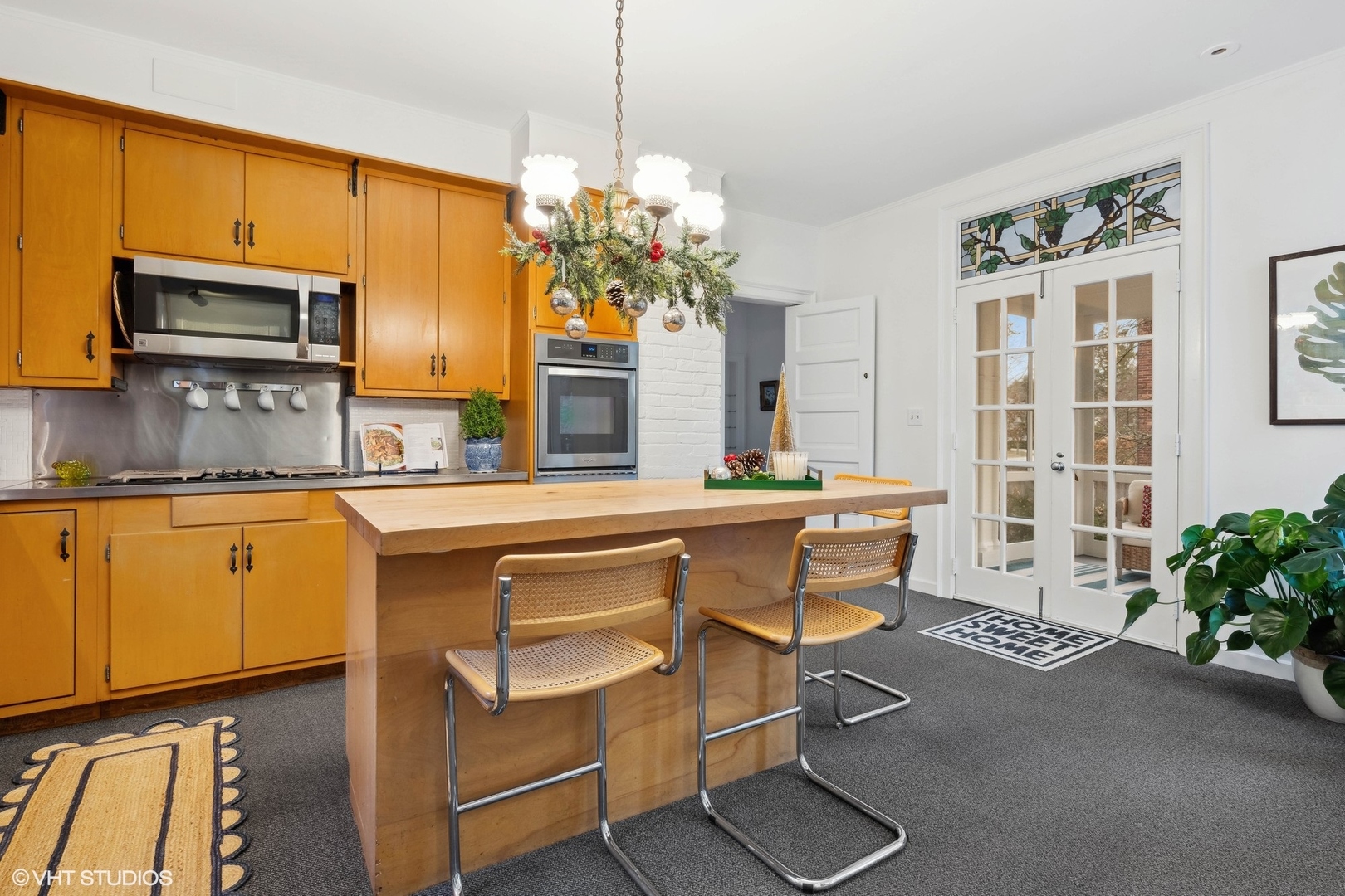 326 Ridge Avenue Winnetka, IL 60093 - Photo 12 of 36 a living room with kitchen island furniture and a chandelier