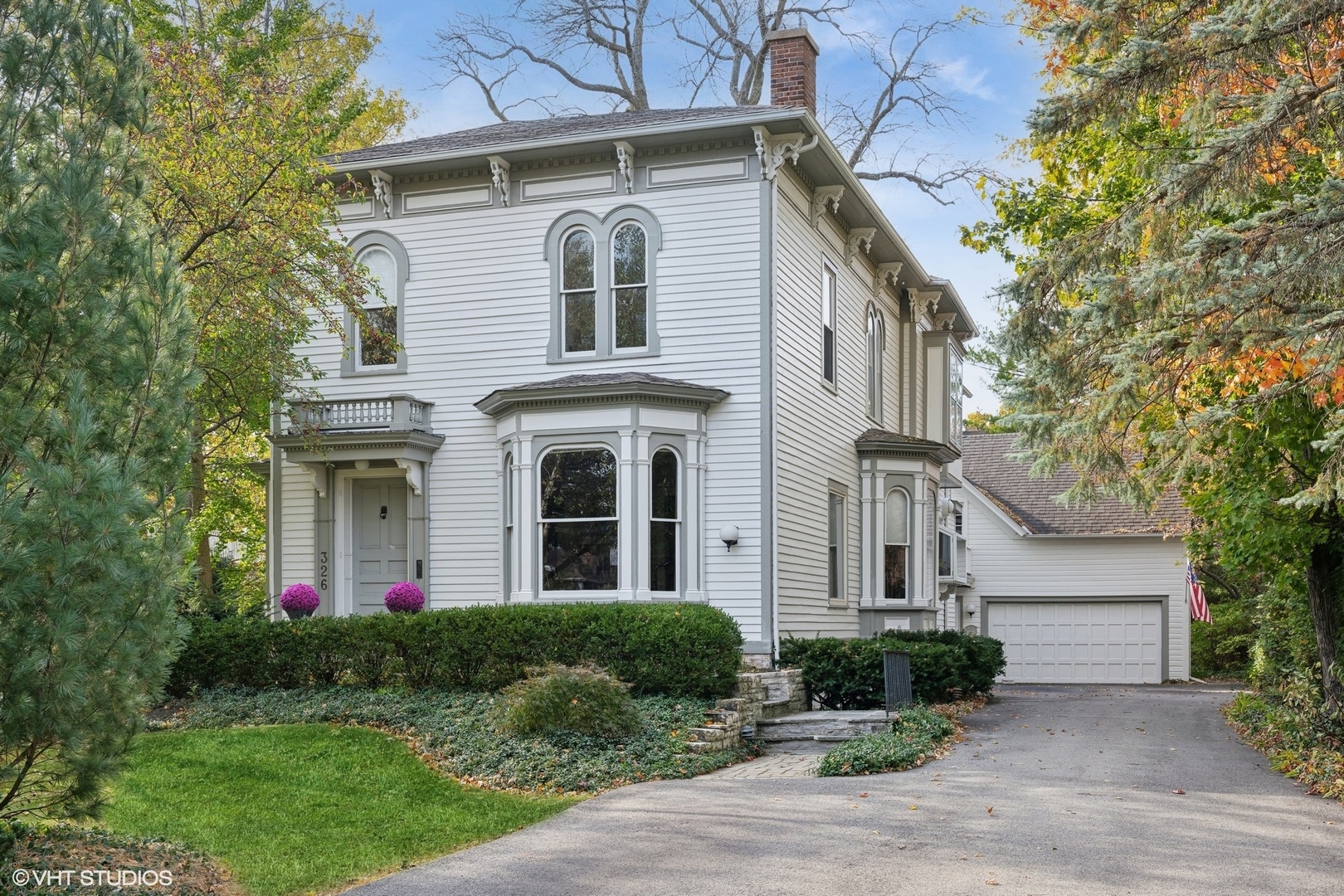 326 Ridge Avenue Winnetka, IL 60093 - Photo 2 of 36 a front view of a house with a yard and trees