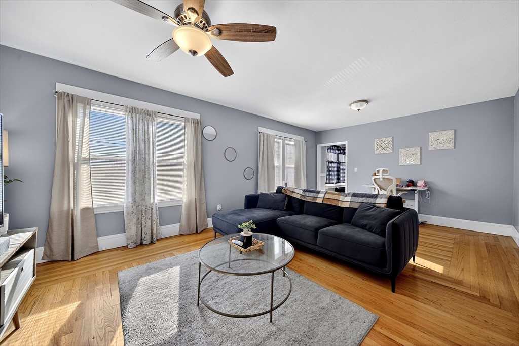 24-26 Jenness Street Springfield, MA 01104 - Photo 5 of 26 a living room with furniture and a window