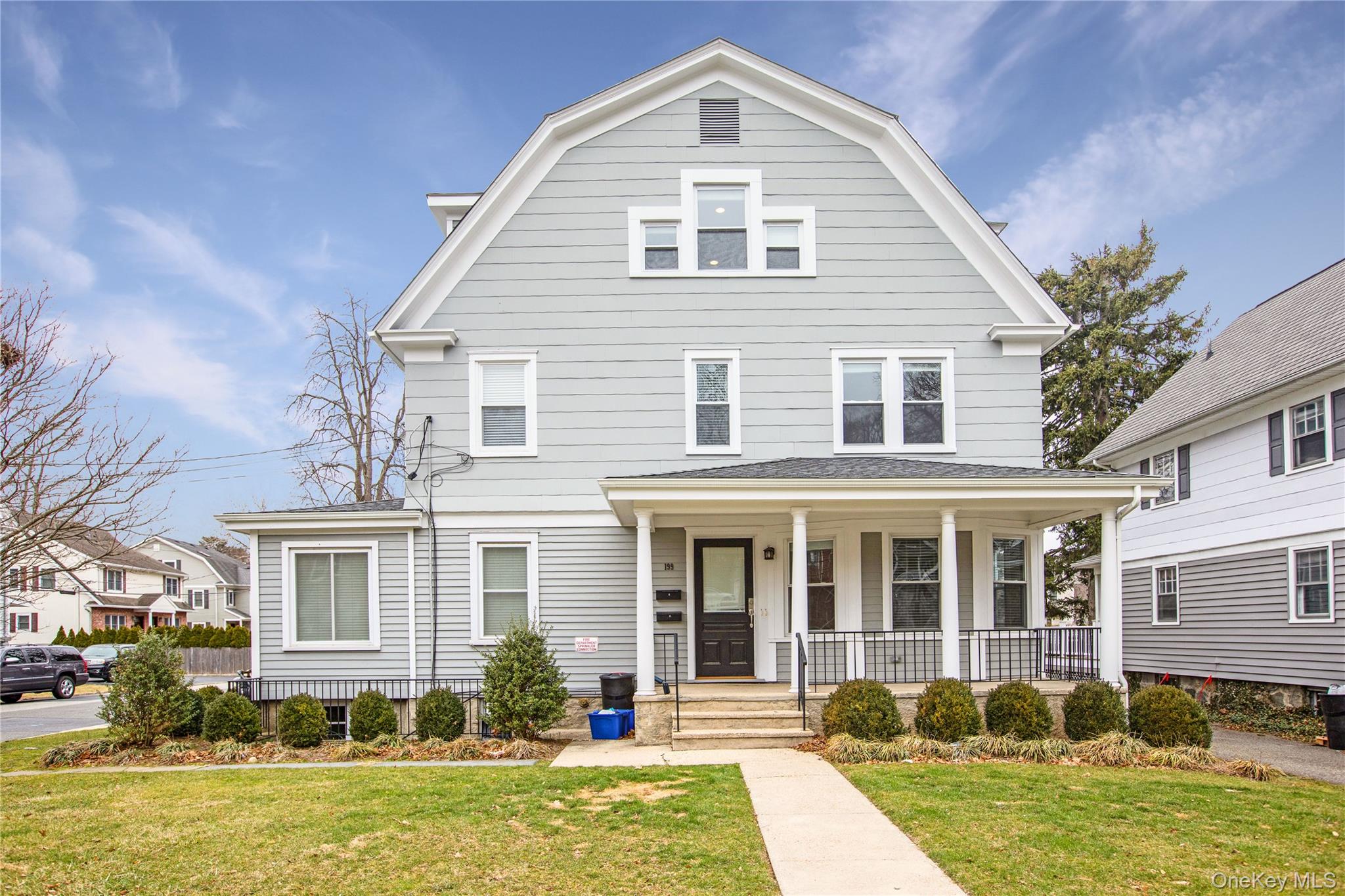 front view of a house with a yard