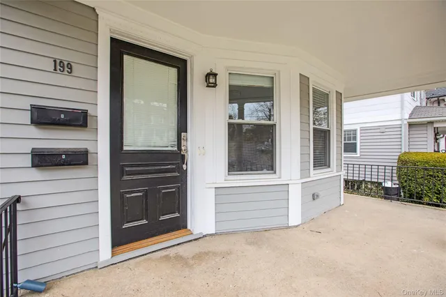 a view of empty room and front door