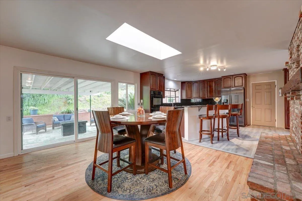 4561 Conrad Drive La Mesa, CA 91941 - Photo 16 of 59 a view of a dining room with furniture window and wooden floor