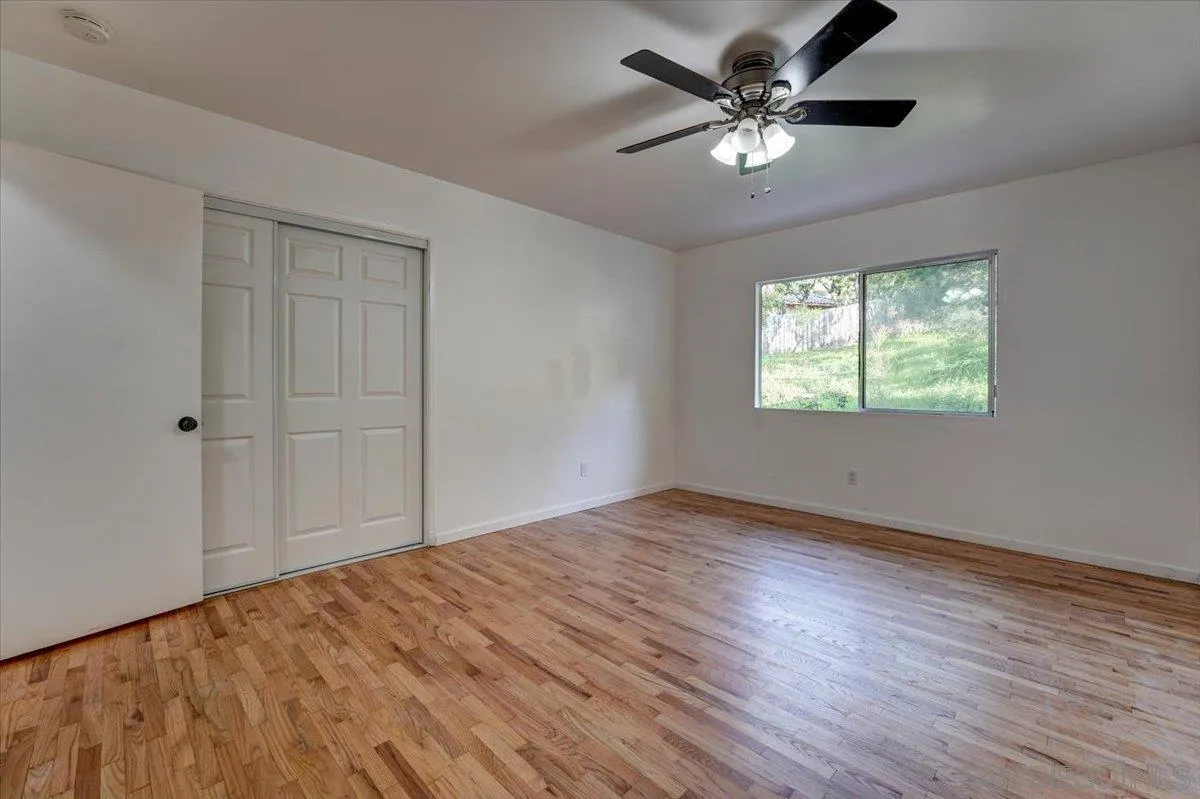 4561 Conrad Drive La Mesa, CA 91941 - Photo 30 of 59 wooden floor in an empty room with a window