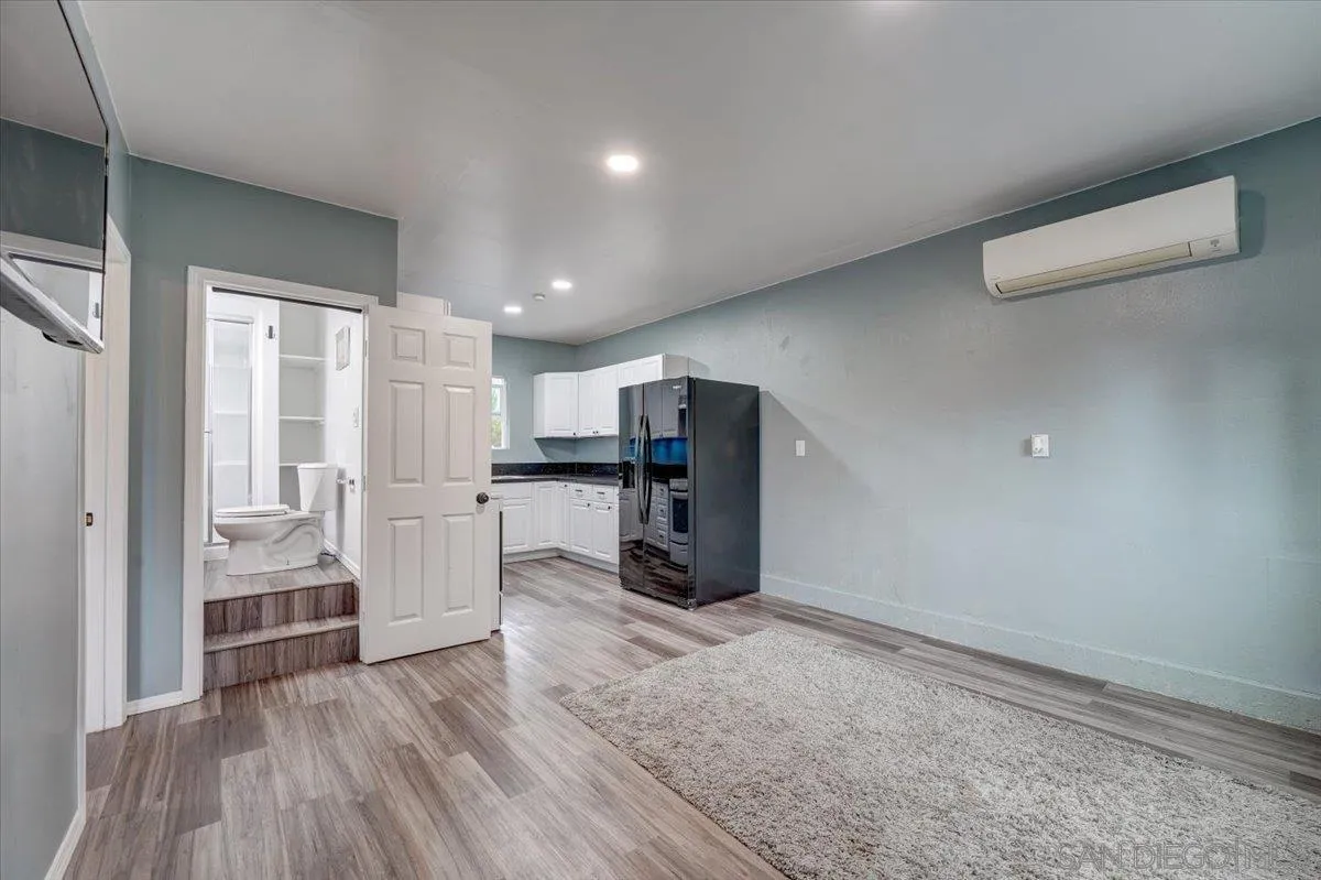 4561 Conrad Drive La Mesa, CA 91941 - Photo 34 of 59 a view of kitchen with refrigerator and wooden floor