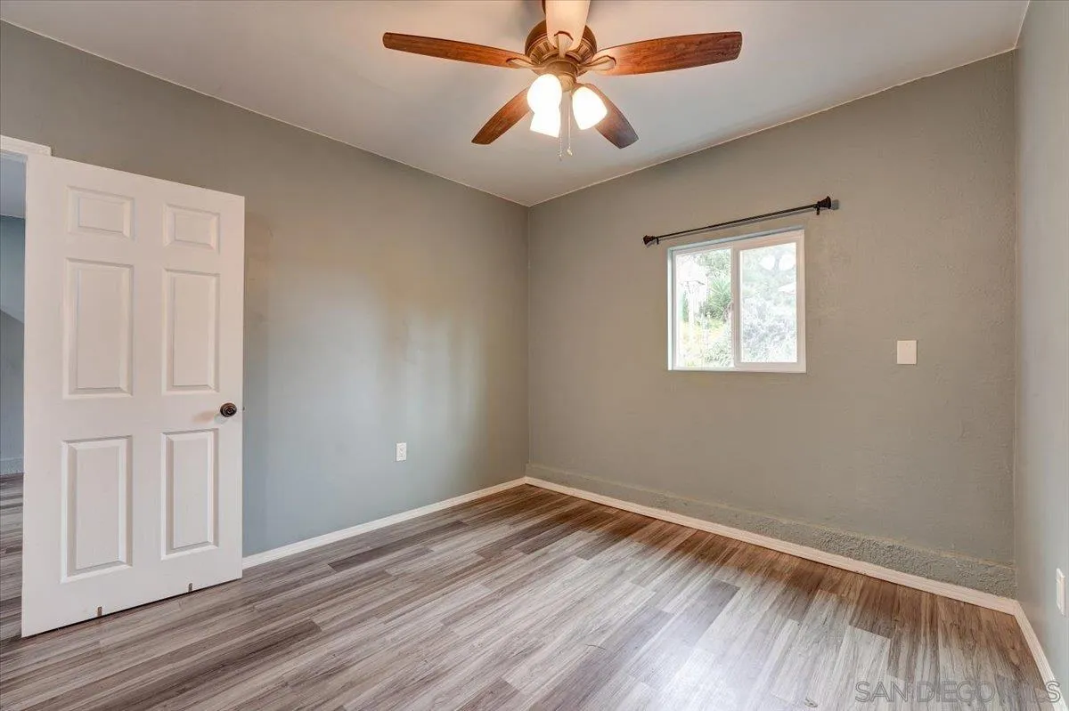 4561 Conrad Drive La Mesa, CA 91941 - Photo 38 of 59 wooden floor in an empty room with a window