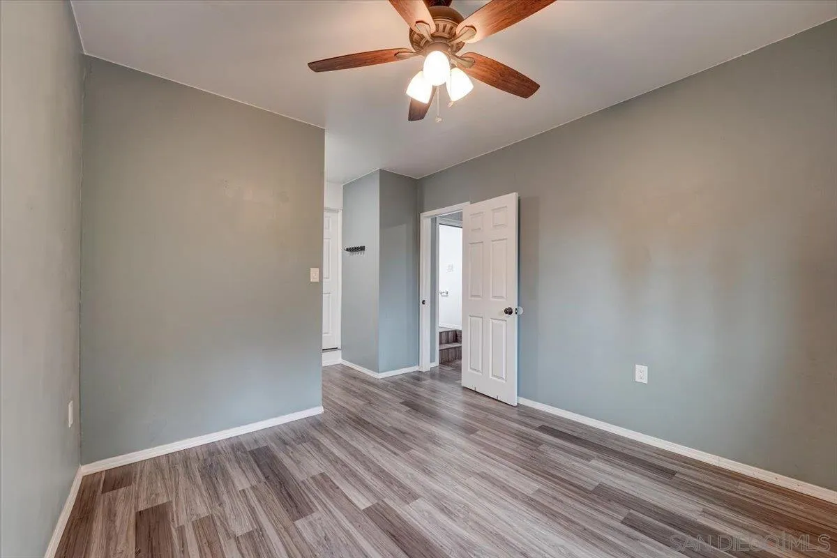 4561 Conrad Drive La Mesa, CA 91941 - Photo 39 of 59 a view of a room with wooden floor and ceiling fan
