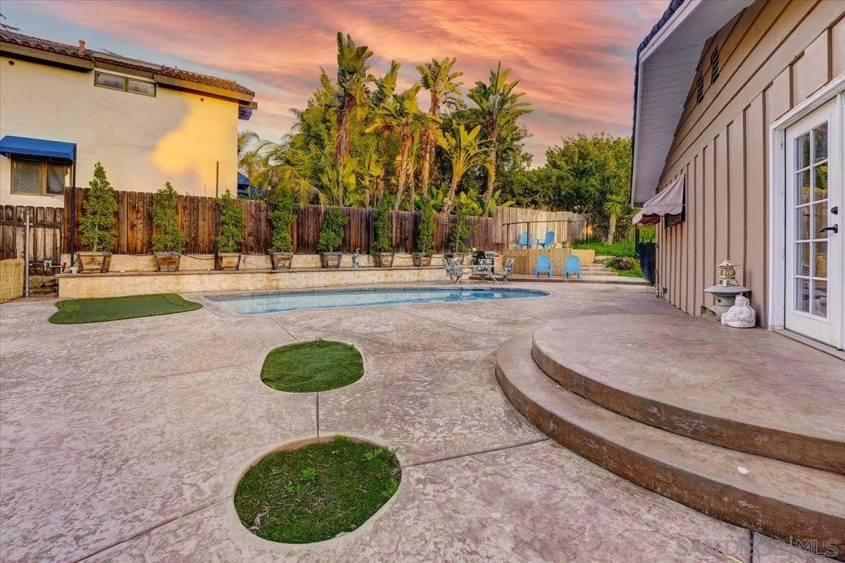 4561 Conrad Drive La Mesa, CA 91941 - Photo 42 of 59 a backyard of a house with lots of green space and fountain