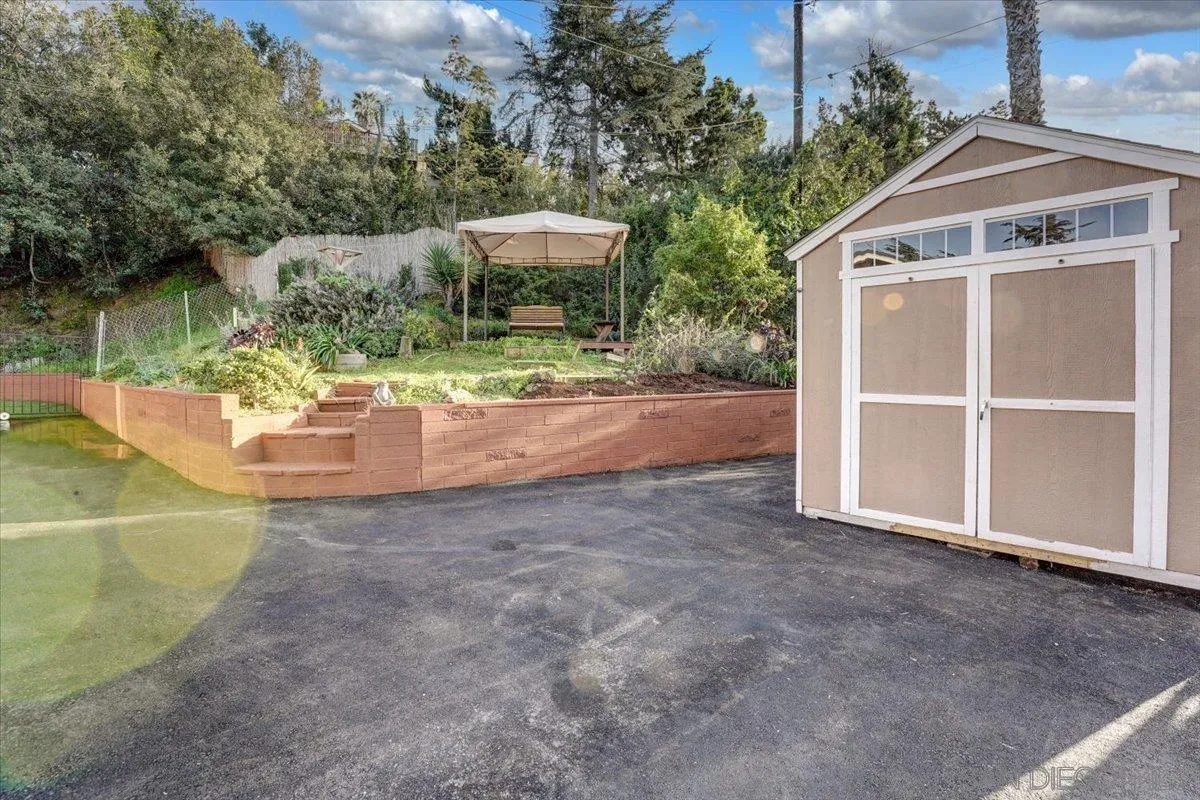 4561 Conrad Drive La Mesa, CA 91941 - Photo 53 of 59 a view of a patio with table and chairs potted plants with lake view