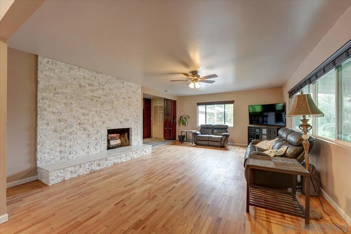 4561 Conrad Drive La Mesa, CA 91941 - Photo 10 of 59 a living room with furniture and a fireplace