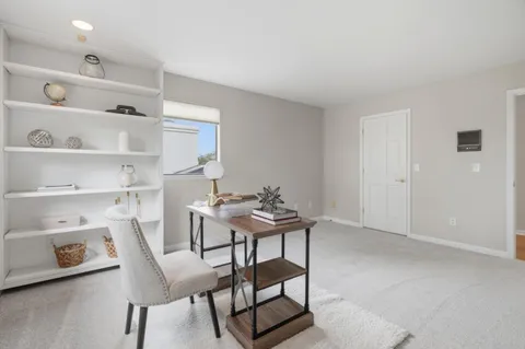 a view of dining room with furniture and front door