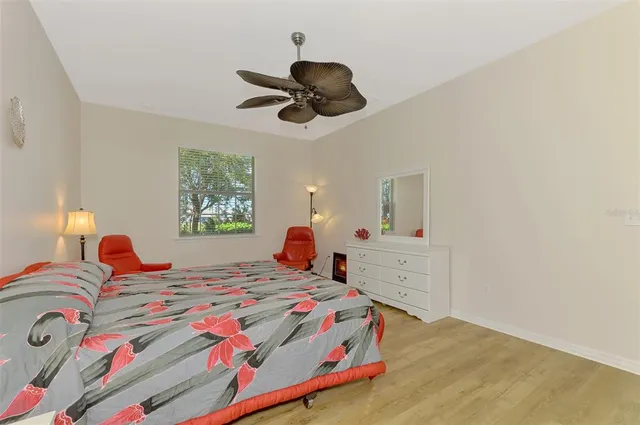 a bedroom with a bed and a lamp