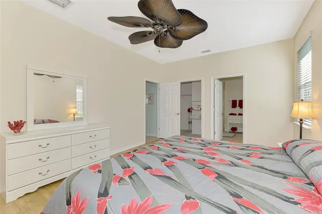 a bathroom with a sink mirror and vanity