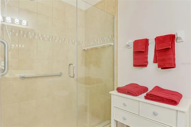a bathroom with a sink double vanity and a mirror