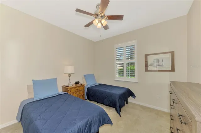 a bedroom with a bed and a lamp