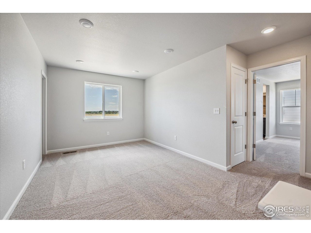 882 Mesic Lane Windsor, CO 80550 - Photo 13 of 26 a view of an empty room