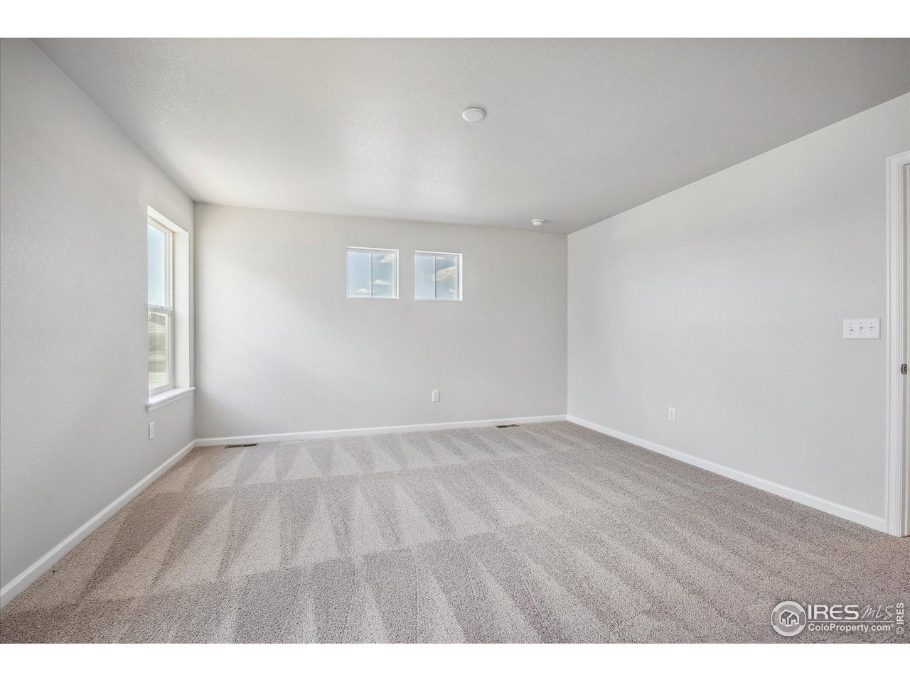 882 Mesic Lane Windsor, CO 80550 - Photo 20 of 26 a view of an empty room