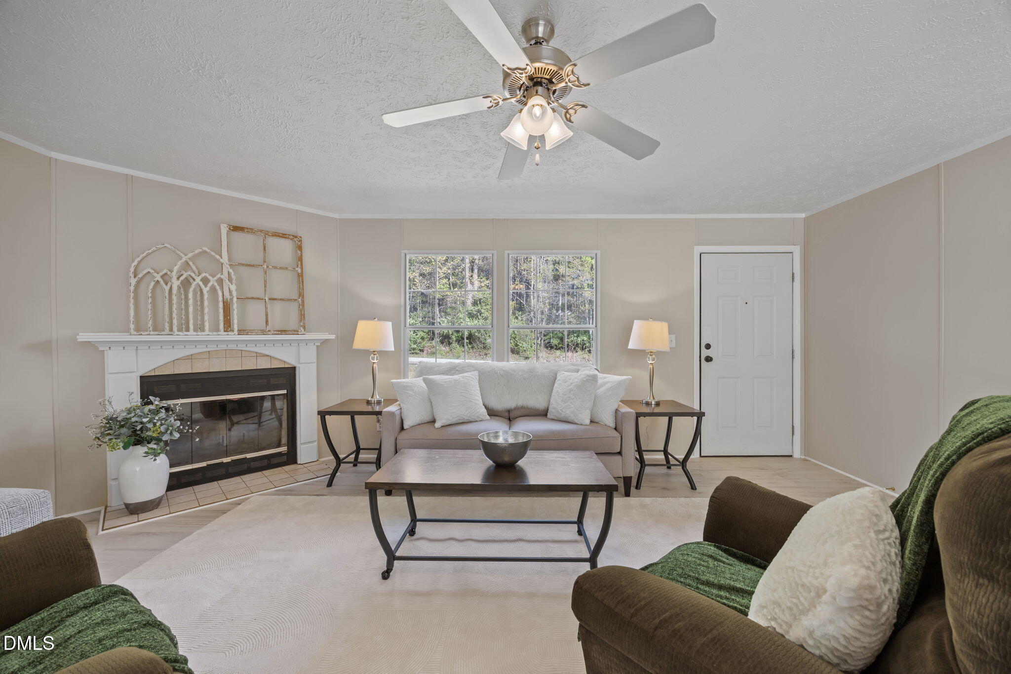 721 General Green Road Kittrell, NC 27544 - Photo 7 of 36 a living room with furniture a fireplace and a window
