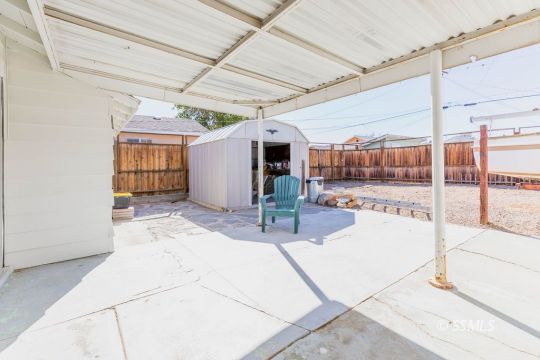 249 North Alvord Street Ridgecrest, CA 93555 - Photo 21 of 39 a view of a patio with table and chairs