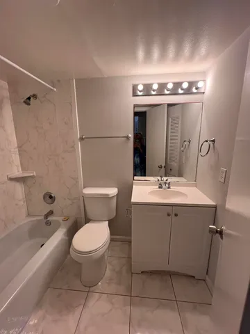a view of a kitchen with refrigerator and microwave