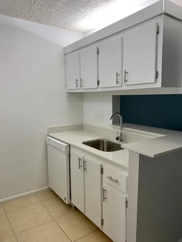 a kitchen with a stove and a refrigerator