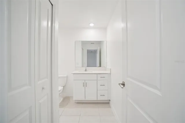 a bathroom with a sink and mirror