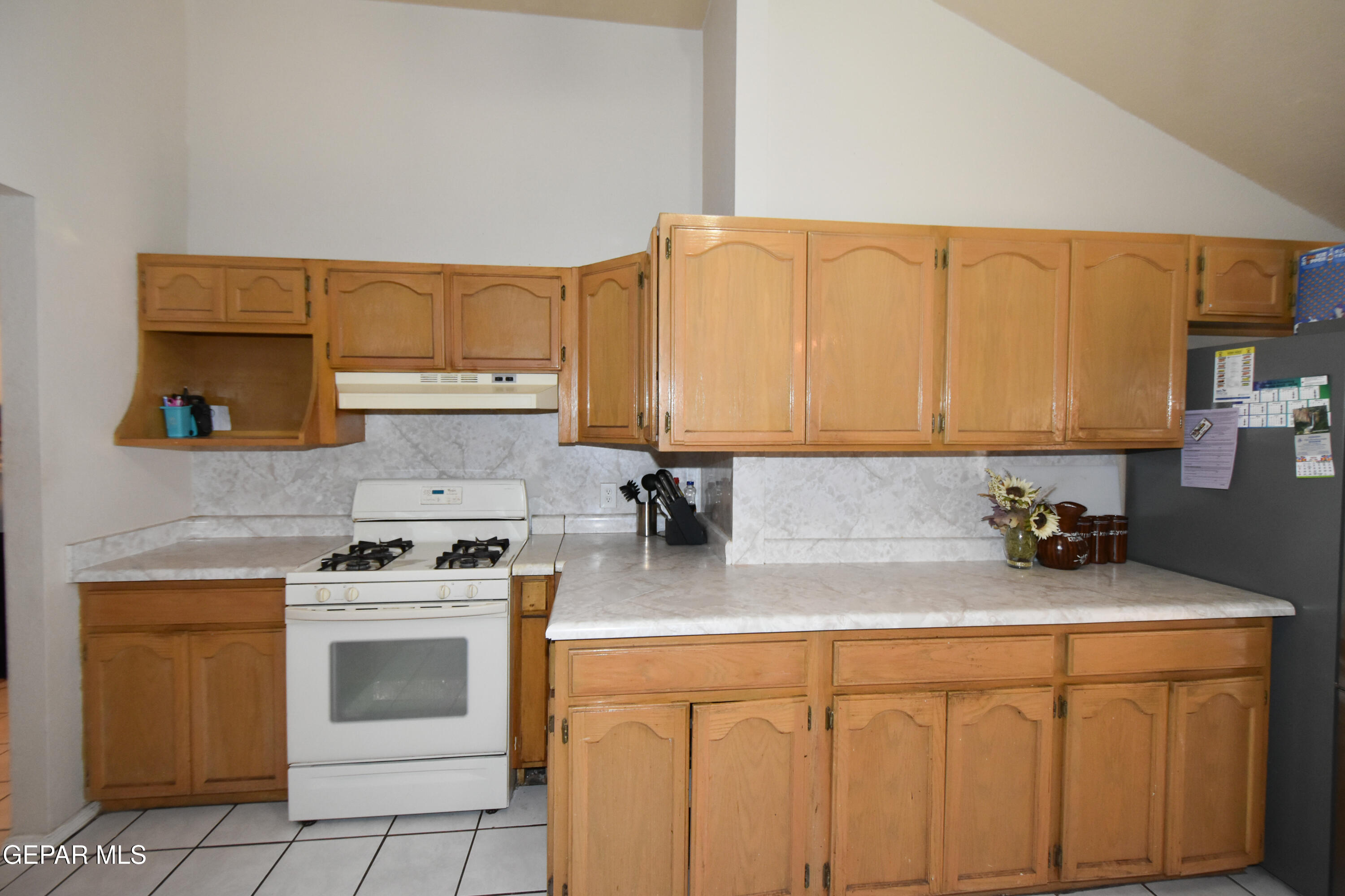 1623 Brian Ray Circle El Paso, TX 79936 - Photo 12 of 41 a kitchen with appliances a sink and cabinets